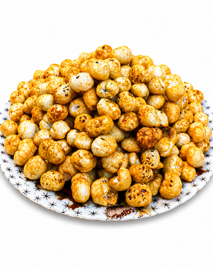 Barbeque roasted makhana fox nuts piled on a patterned ceramic plate