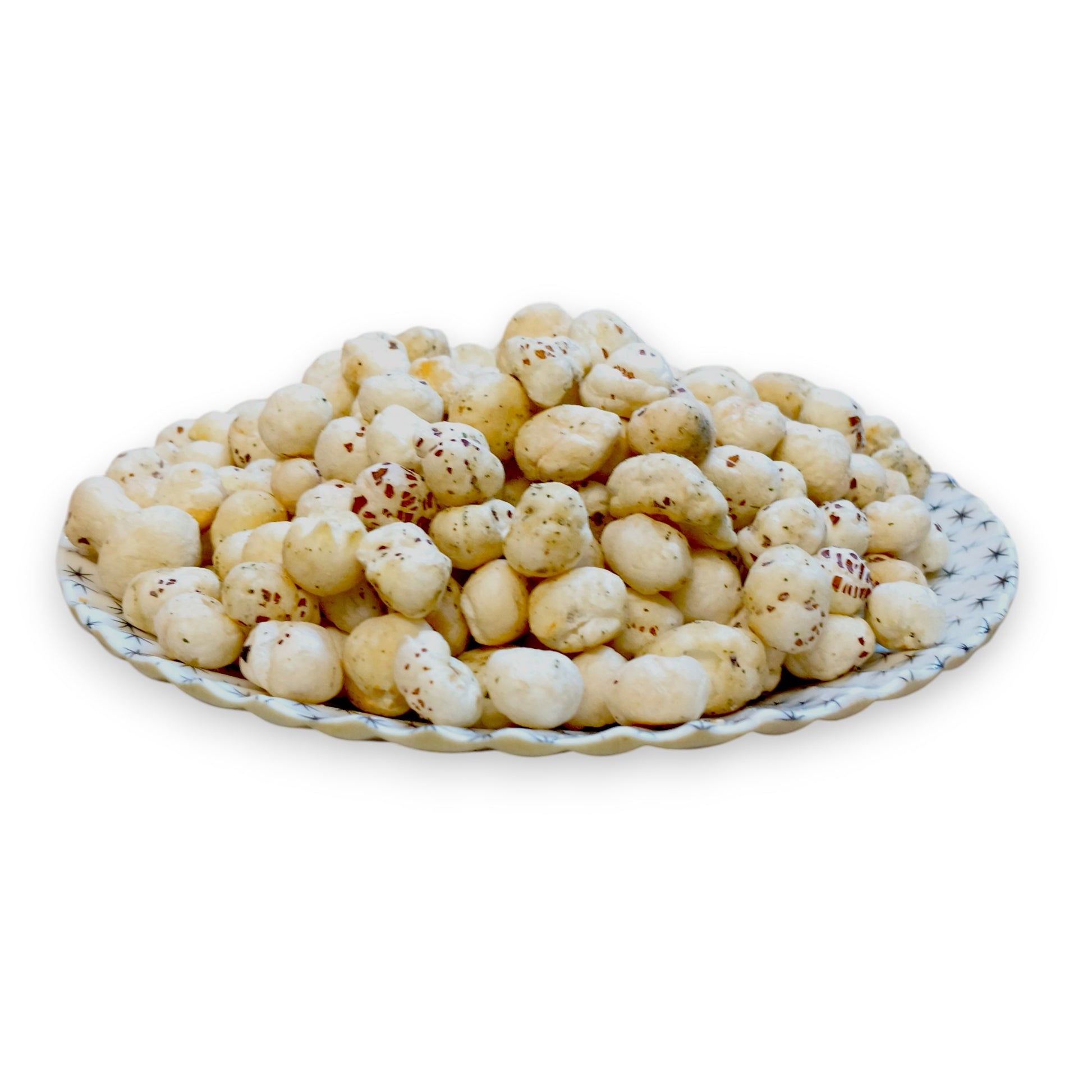 Cream and onion seasoned makhana fox nuts served on a patterned plate