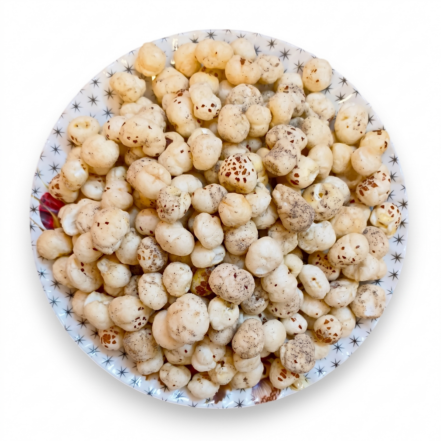 Overhead view of lightly salted Himalayan pink salt makhana filling a decorative plate