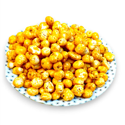 Side view of a plate heaped with spicy peri peri makhana